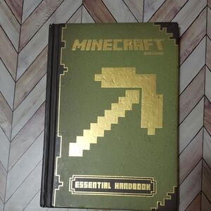 Minecraft Essential Handbook with Gold Pickaxe Design